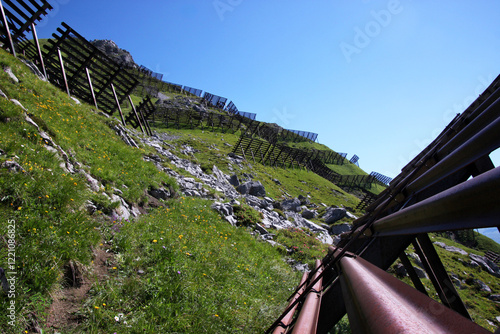 Metal avalanche protection structures on Glongspitze mountain slope in the Vorarlberg Alps, Austria