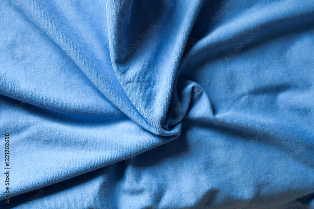 Close-up of textured blue fabric. Soft, draped material with subtle wrinkles and folds. Perfect for textile design or background. Close-up of textured blue fabric. Soft, draped material with subtle wrinkles and folds. Perfect for textile design or background.