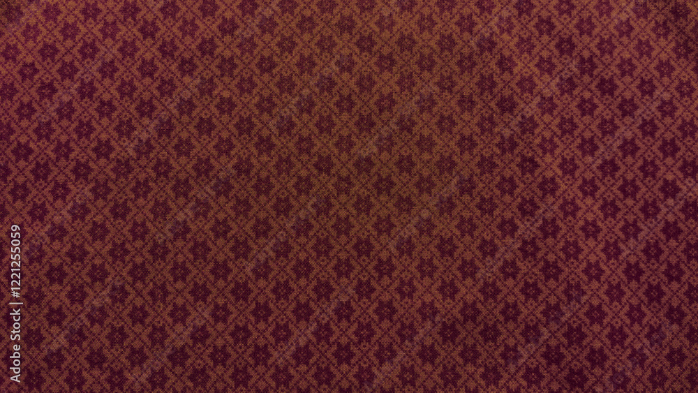 A close up of a red and brown fabric with a pattern A close up of a red and brown fabric with a pattern