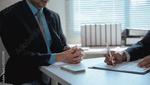 Принти на полотні Businessman signing contract after receiving bribe from corrupt partner