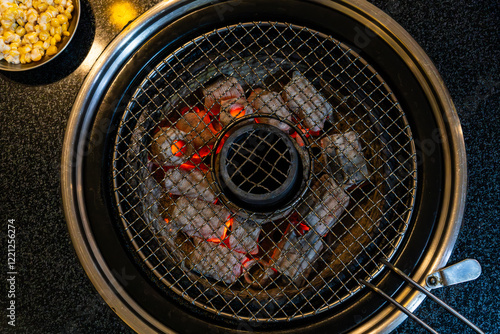 Obraz na płótnie burning charcoals, and grill in the restaurant w salonie