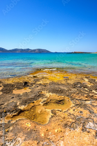 Obraz na płótnie Ano Koufonisi beach with rocks and azure sea water. Small Cyclades, Greece w salonie