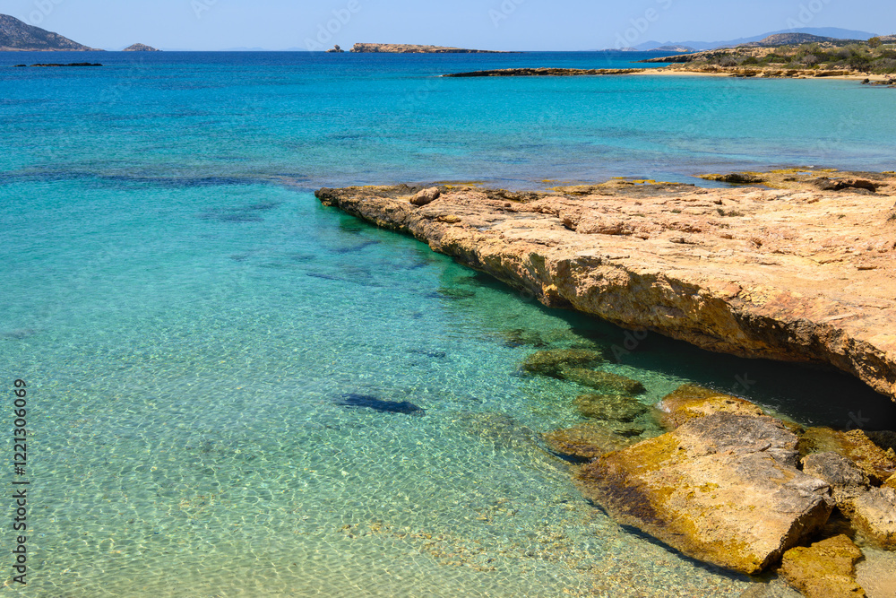 Ano Koufonisi beach with rocks and azure sea water. Small Cyclades, Greece