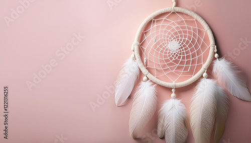 dreamcatcher with feathers against soft pastel background photo