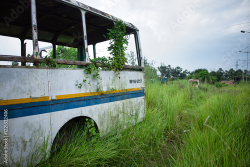 an old abandoned bus in an empty field