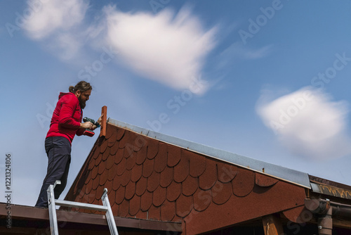 Wallpaper Mural A man repairs the roof Torontodigital.ca