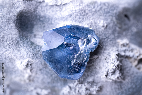 Benitoite blue crystal. Specimen from Gem mine, San Benito Co., California, USA. Micro photography extreme close-up. microscope mineral crystal photography for Scientific use.
