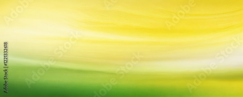 Colorful abstract background with gentle gradients of yellow and green hues blending harmoniously in a serene composition