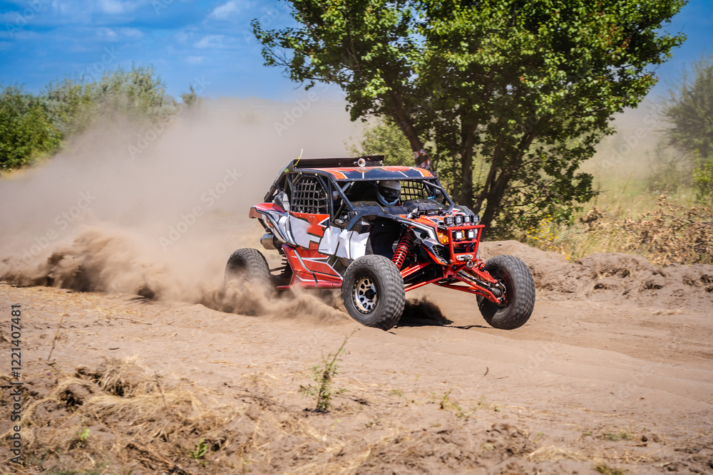 Outdoor activities UTV buggy moves on dusty road. 4x4, extreme, adrenalin. Outdoor activities UTV buggy moves on dusty road. 4x4, extreme, adrenalin.