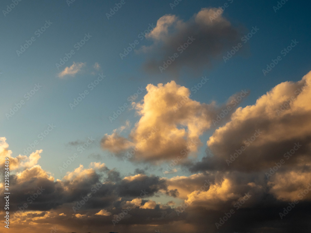 Dark dramatic sunset sky with clouds and sun beams and flare. Nature background for design and sky replacement. Dark dramatic sunset sky with clouds and sun beams and flare. Nature background for design and sky replacement.