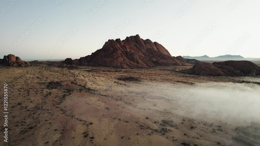 Rocky mountain in desert with fog Rocky mountain in desert with fog