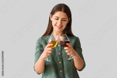 Young woman with glasses of...