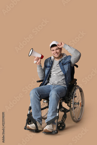 Young man in wheelchair wit...