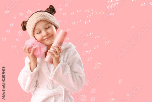 Cute little girl in bathrob...