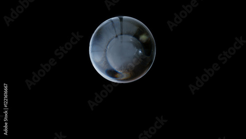 Obraz na płótnie Crystal ball reflecting light on a black background, symbolizing future and divination w salonie