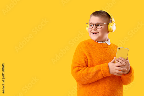 Little boy with headphones ...
