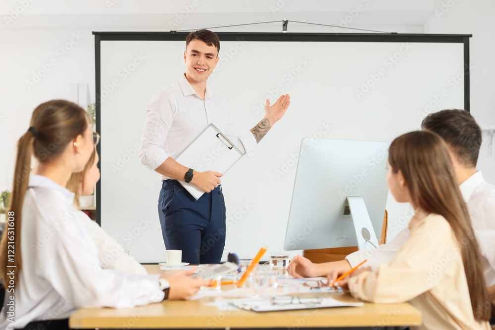 Businessman near projector screen during negotiations in conference hall Businessman near projector screen during negotiations in conference hall