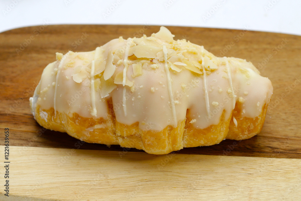 White chocolate croissant on white background. White chocolate croissant on white background.