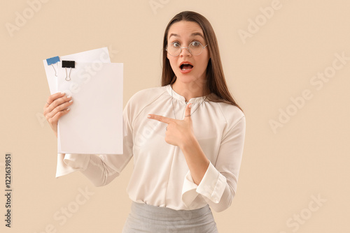 Shocked secretary pointing ...