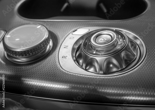 Modern control knob on automotive console unit ,elegant car interiors photo