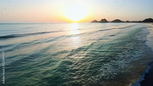 A cinematic footage of sunrise over the beach  