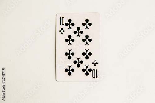 Ten of Clubs playing card on white background, top view photo