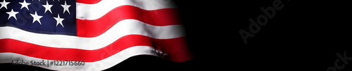 Free Download American flag waving against a black background, capturing the spirit of patriotism and national pride during a quiet evening - GFXLoad