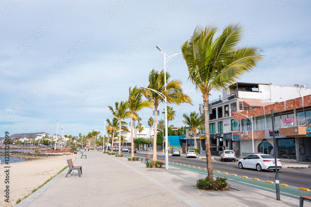 Sunny Beach Holiday Scene in La Paz, Baja California Sur - Mexican Beaches with Palm Trees, Malecon and Boardwalk, sunshine and beach buildings Sunny Beach Holiday Scene in La Paz, Baja California Sur - Mexican Beaches with Palm Trees, Malecon and Boardwalk, sunshine and beach buildings