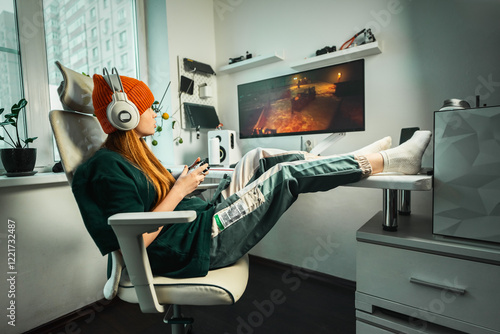 Girl enjoying video game in ergonomic chair with cutting-edge gaming equipment. Workplace features monitor, headphones, joystick, blending comfort, technology, and creativity in home interior.