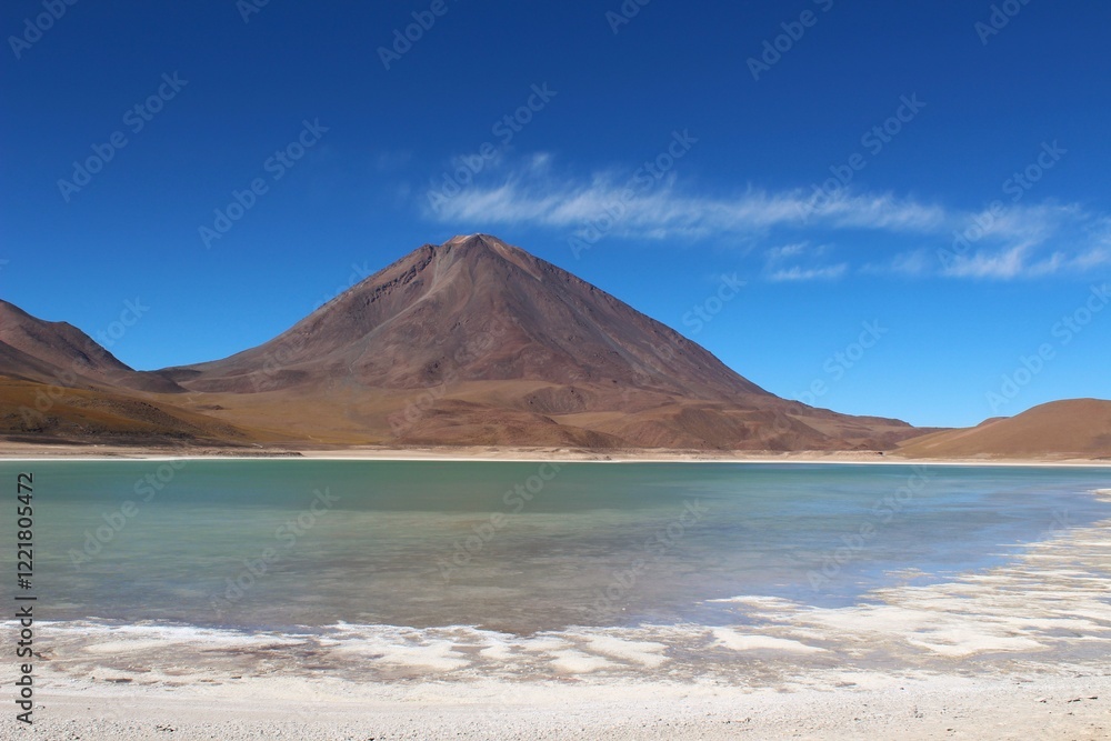 Fototapeta premium Natural landscape of Bolivia, featuring altiplano lagoon, Andean mountains, volcanoes and clear blue skies in a stunning arid&nbsp;environment
