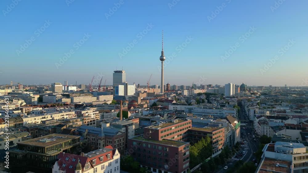 Berlin tv tower rising above rooftops and a construction site at senefelderplatz during sunset. Lovely aerial view flight speed ramp hyper motion time lapse Berlin tv tower rising above rooftops and a construction site at senefelderplatz during sunset. Lovely aerial view flight speed ramp hyper motion time lapse