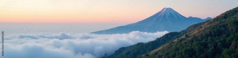 Naklejka premium Misty morning on the mountain peak with fog rolling in, sky, mountain
