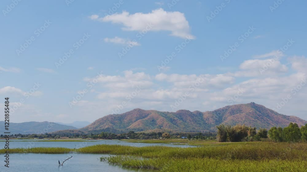 Lush green wetlands and serene mountains under clear blue sky create tranquil outdoor landscape, showcasing beauty of nature and vibrant scenery. Timelapse Cloud Landscape 4K Lush green wetlands and serene mountains under clear blue sky create tranquil outdoor landscape, showcasing beauty of nature and vibrant scenery. Timelapse Cloud Landscape 4K