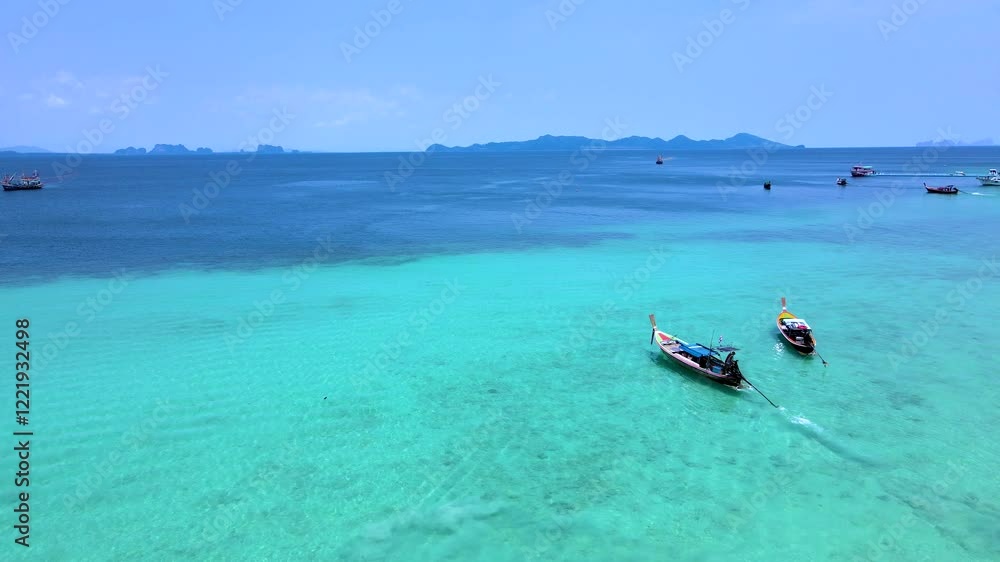 Sail through the stunning turquoise waters of Koh Kradan, Thailand. Sail through the stunning turquoise waters of Koh Kradan, Thailand.
