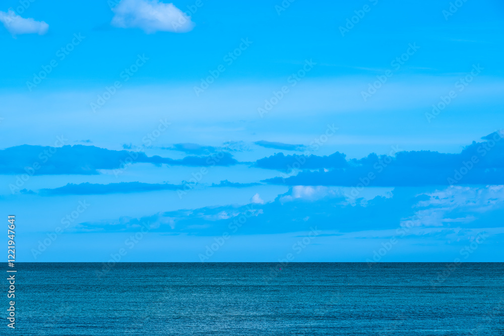Obraz premium Nature of the beach and sea Summer with sunshine, sandy beaches, clear blue waters sparkling against the blue sky. On an island with good ecology and environment Background for summer vacation