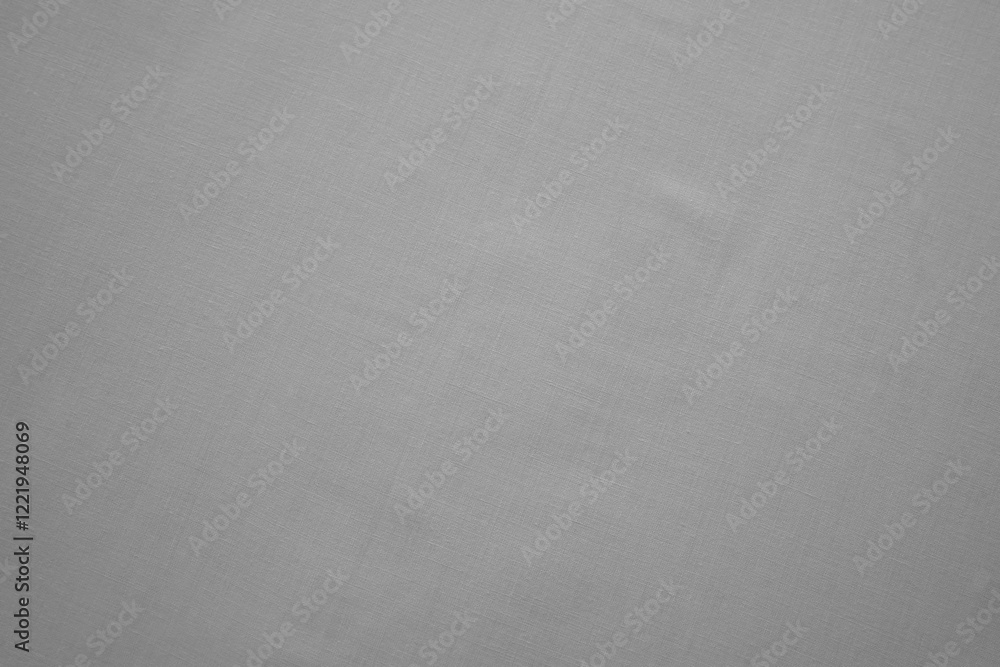 Close-up of texture of plain grey fabric. Monochromatic textile material background for design and templates. Copy space. Close-up of texture of plain grey fabric. Monochromatic textile material background for design and templates. Copy space.