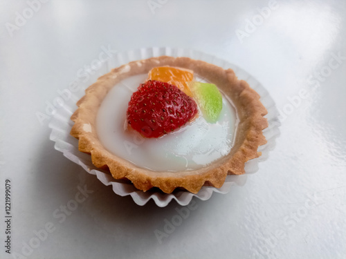 Small fruit pia cake on a white background. Kue Pia Buah. photo