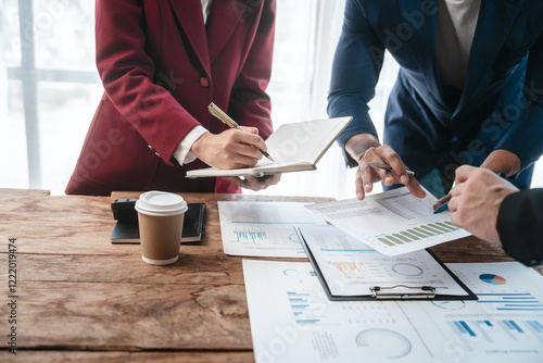 A close-up of a businessman explaining finance, business planning, and marketing during a meeting at the table,demonstrating teamwork and collaboration to achieve strategic goals successful outcomes photo