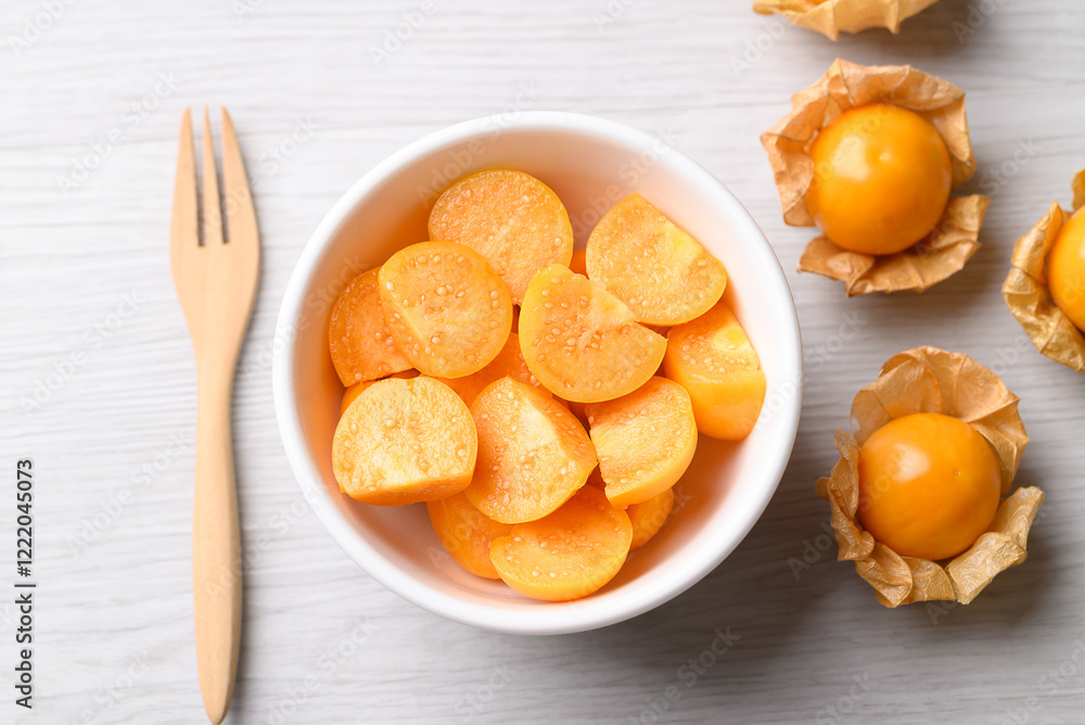 Fresh Cape gooseberry or Golden berry (Physalis peruviana) in bowl ready to eating, Healthy fruit, Top view Fresh Cape gooseberry or Golden berry (Physalis peruviana) in bowl ready to eating, Healthy fruit, Top view