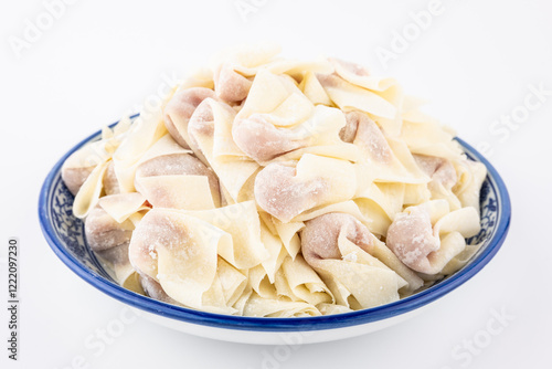 A plate of wrapped wontons photo