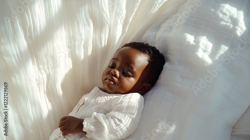 baby sleeping peacefully in soft white bedding photo