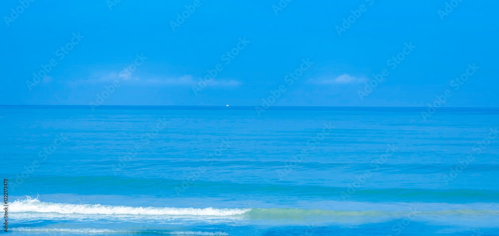 The summer vacation background with Nature on the beach and sea blue water summer with sunlight, sandy beach The summer vacation background with Nature on the beach and sea blue water summer with sunlight, sandy beach