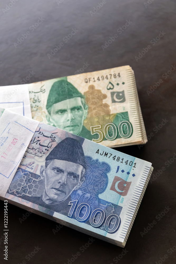 Pakistani currency note closely on wooden background. Pakistani currency note closely on wooden background.
