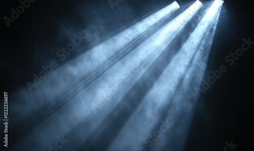 Light beams shining through smoke in dark room, ideal for atmospheric backgrounds