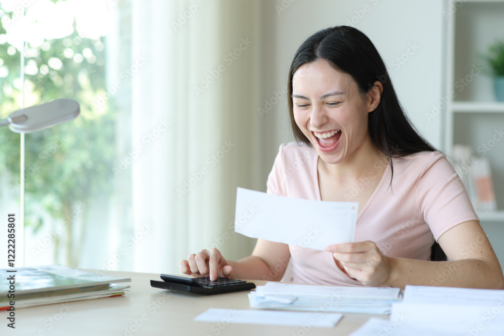 Excited asian woman calculating checking bill Excited asian woman calculating checking bill