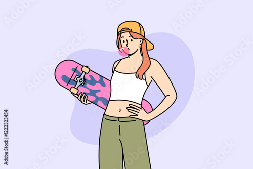 Teenage girl with skateboard in hands inflates bubble from chewing gum, demonstrating involvement in youth subculture. Gen z woman in crop top and wide-legged pants holds skateboard during summer walk