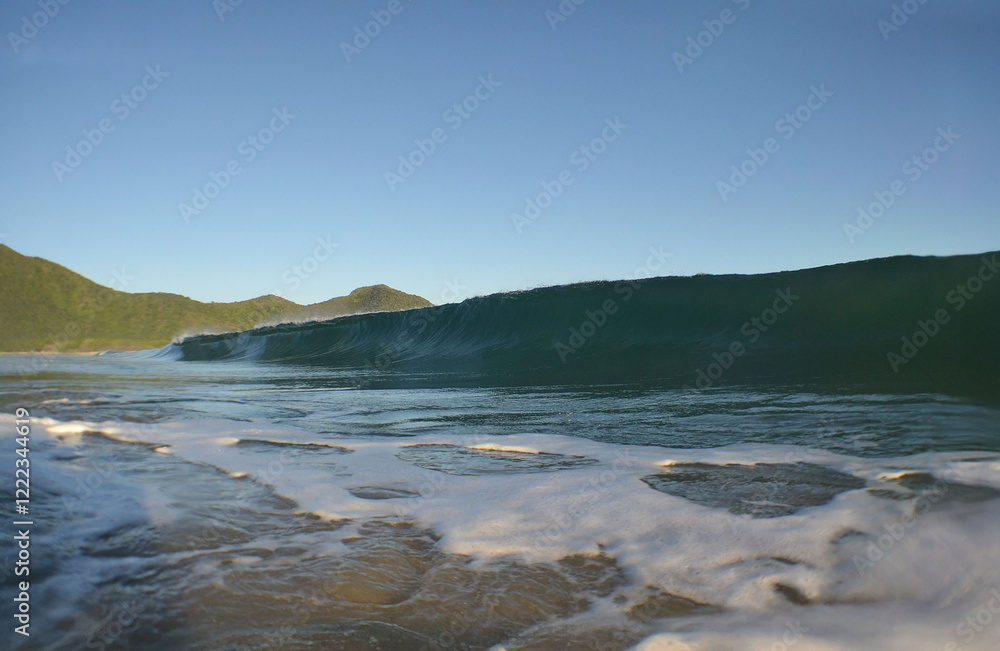 A beautiful wave on a beach on the coast of Venezuela in the Caribbean Sea A beautiful wave on a beach on the coast of Venezuela in the Caribbean Sea