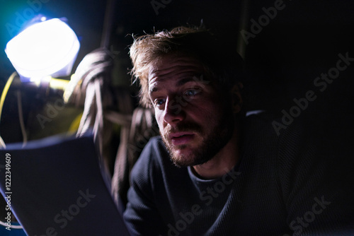 Portrait of actor at theatre studying script backstage photo