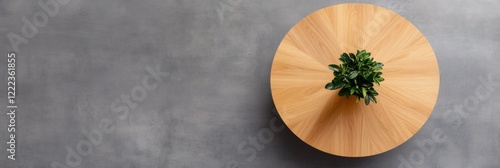Minimalist Office Decor Round Wooden Table with Green Plant on Concrete Surface - Contemporary Workspace Design and Sustainable Aesthetic for Business Innovation