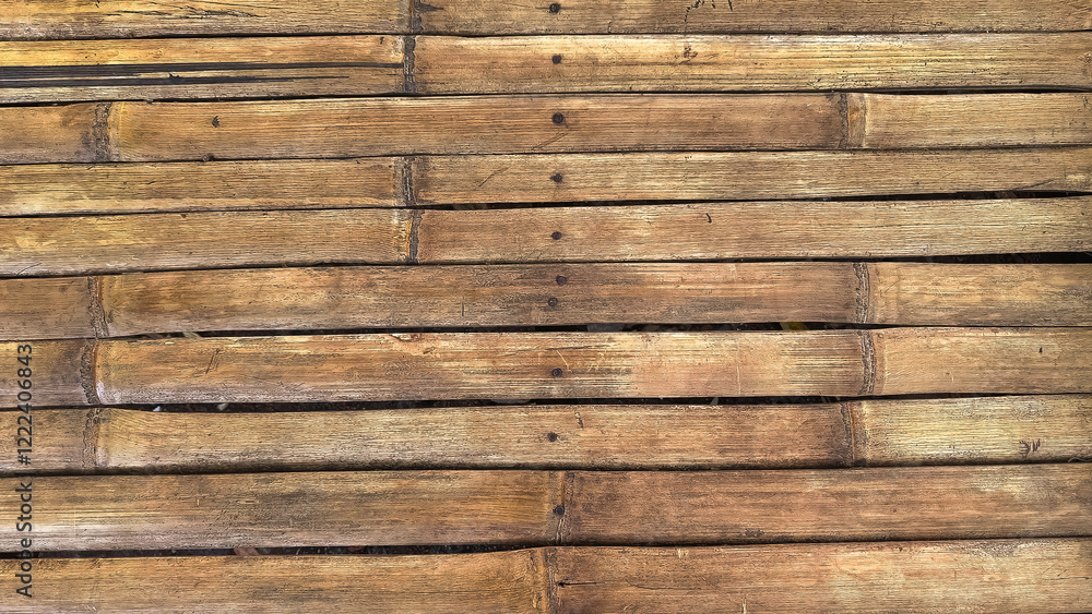 A close-up of arranged wooden planks showcasing natural texture and tones, perfect for backgrounds or natural themes. A close-up of arranged wooden planks showcasing natural texture and tones, perfect for backgrounds or natural themes.